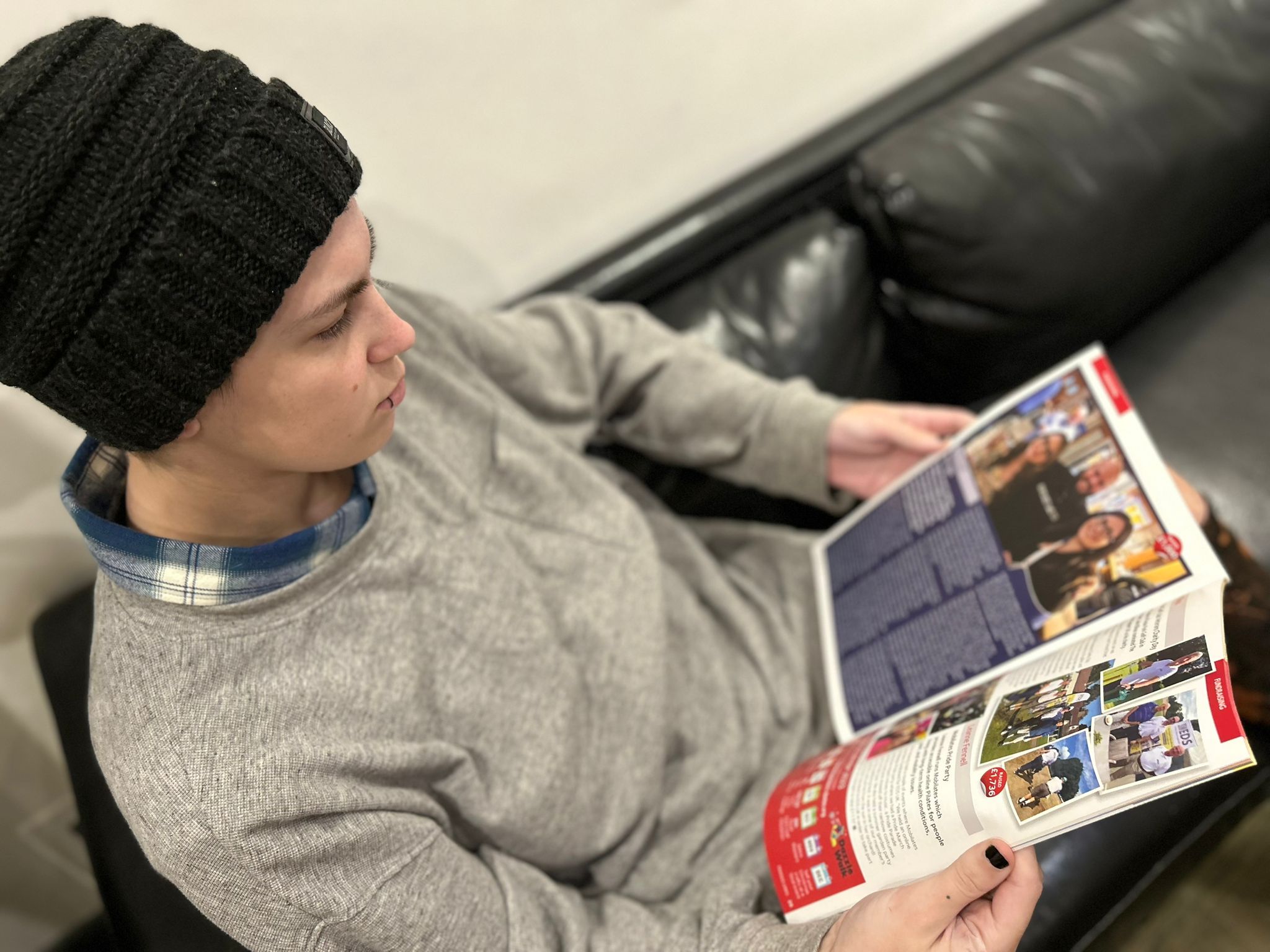 Image of a person reading Fragile Links magazine
